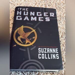 The Hunger Games by Suzanne Collins - Black & Gold Hardcover